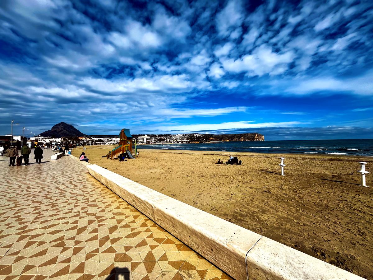 The diamond-tiled Arenal promenade under a dramatic spring sky