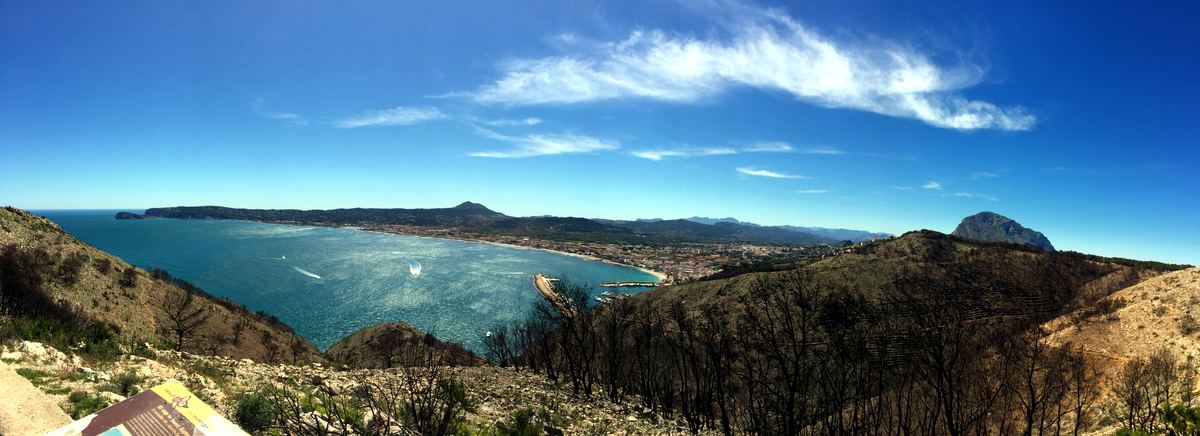 Panorama of Jávea’s bay and Cap Prim from the slopes of Montgó under a clear sky