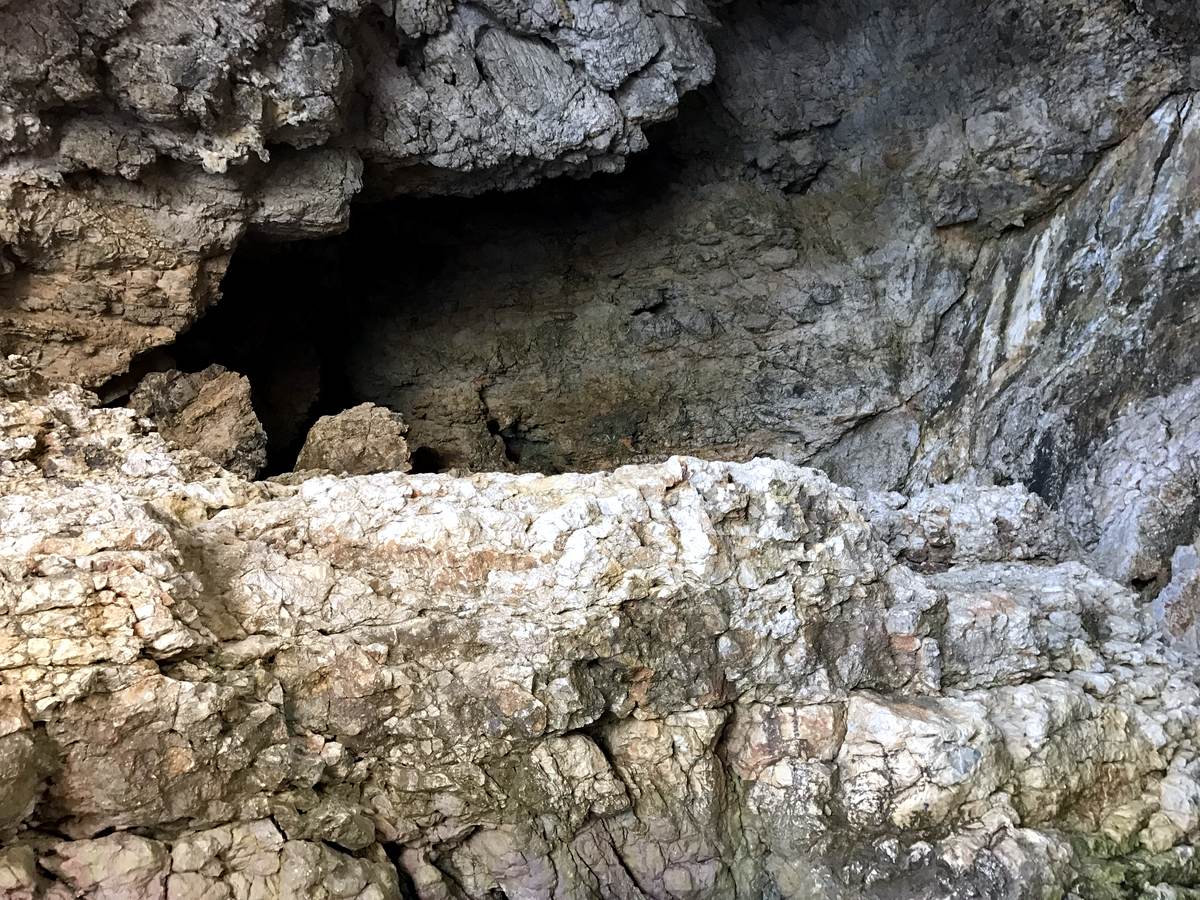 Weathered limestone riddled with natural caves on the Cumbre del Sol coast at Benitachell