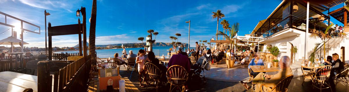 A busy beach-bar terrace on a sunny Jávea afternoon