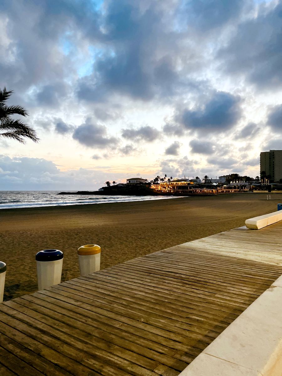 First light on the boardwalk with the bay still and empty