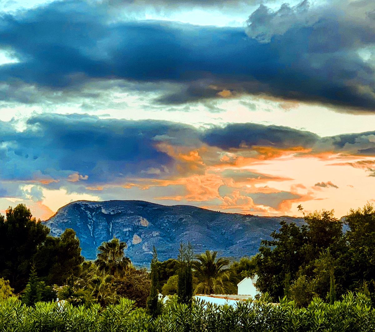 A fiery autumn sunset over the ridge behind Jávea