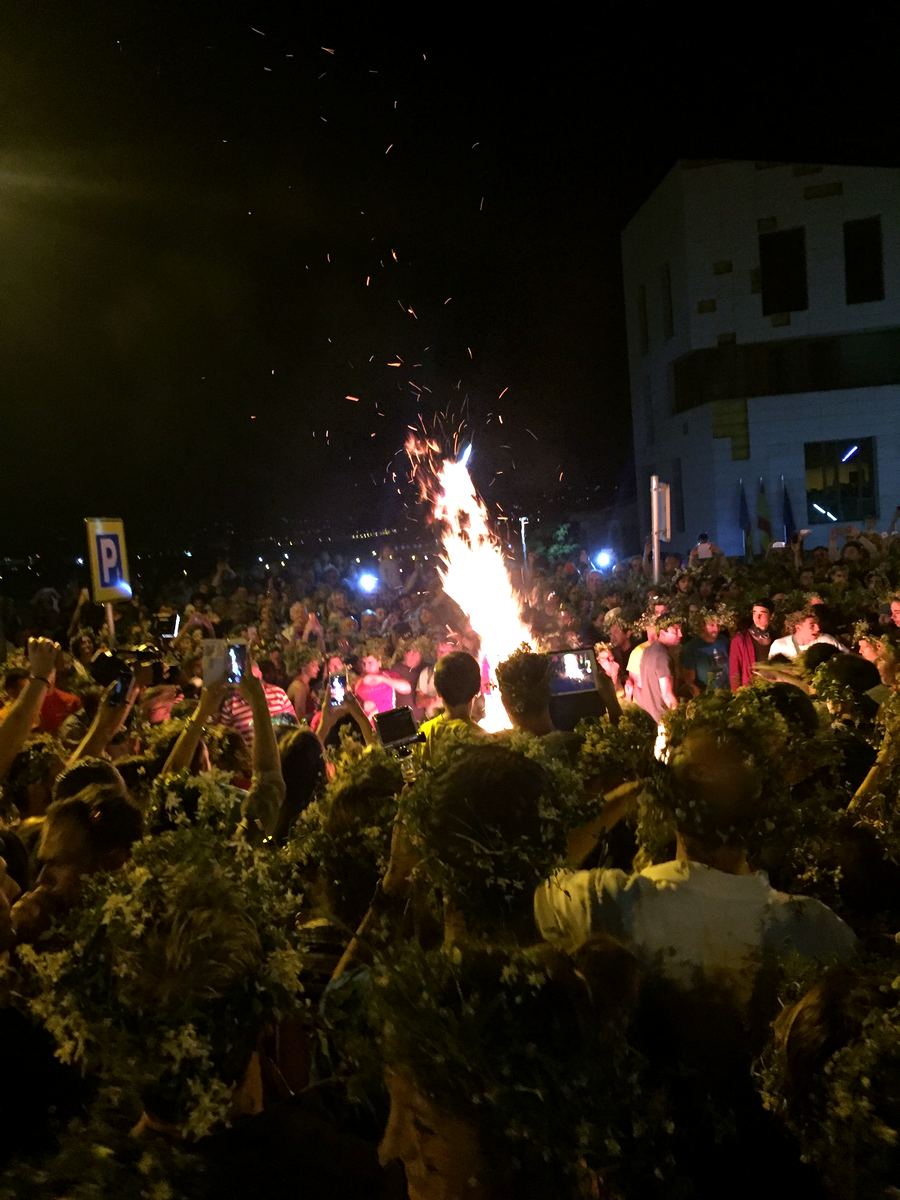The crowd around a street bonfire at the Fogueres de Sant Joan, Jávea