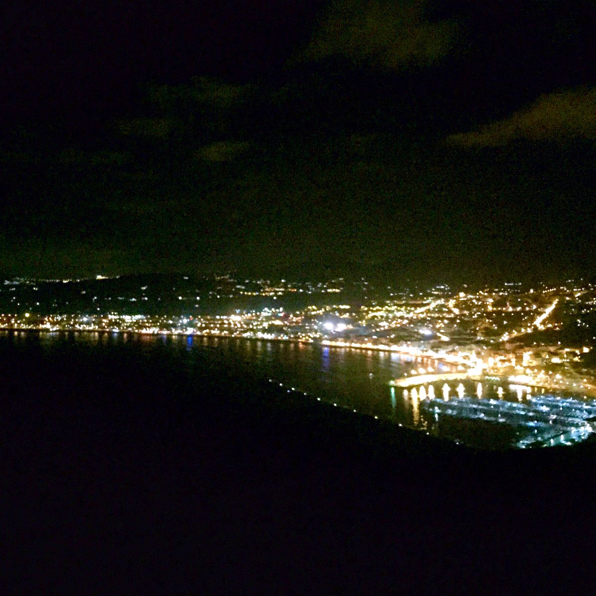 The lights of Jávea port and bay at night from the Cap de Sant Antoni mirador