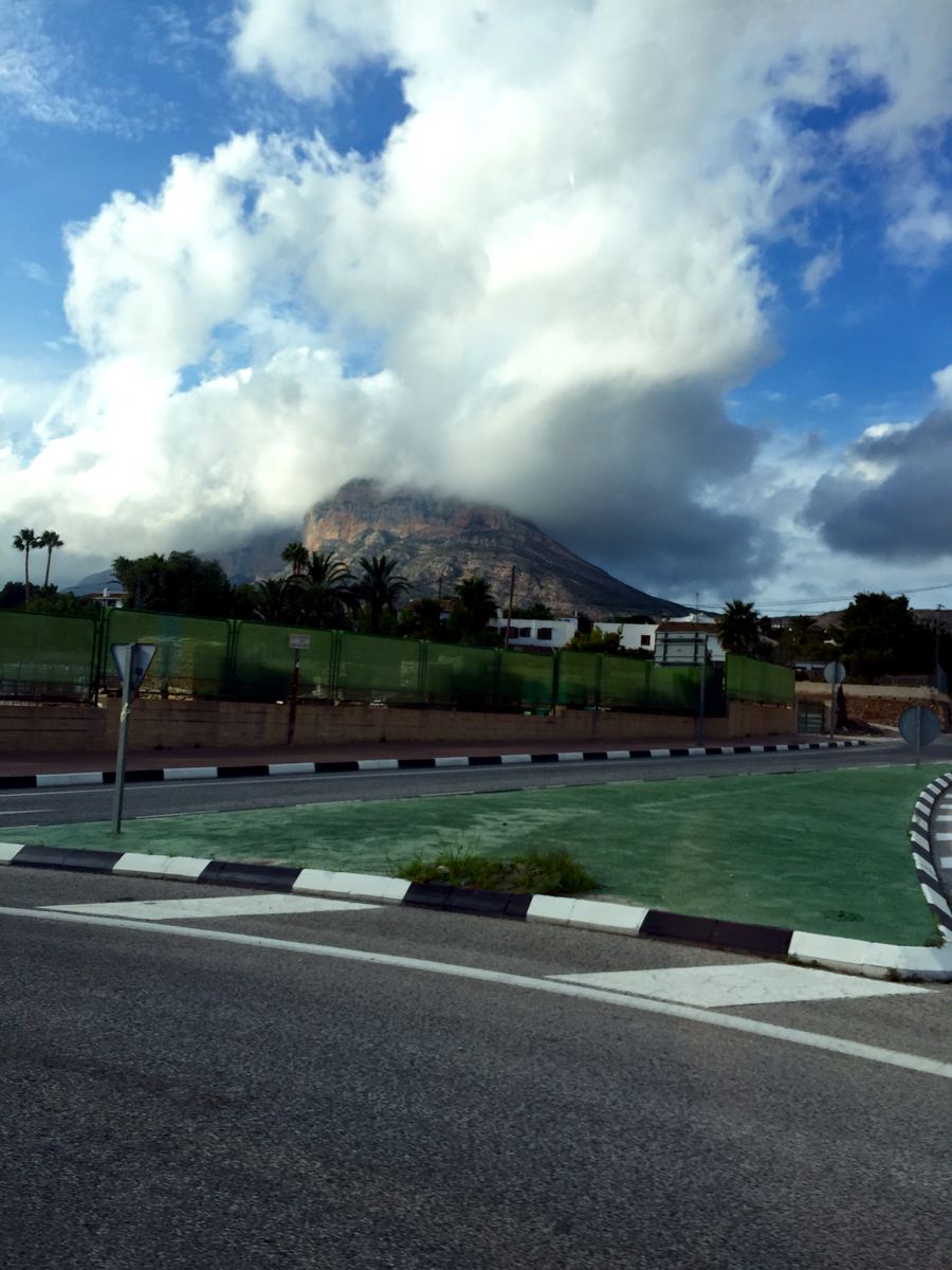 A cloud cap forming over Montgó — the mountain making its own weather
