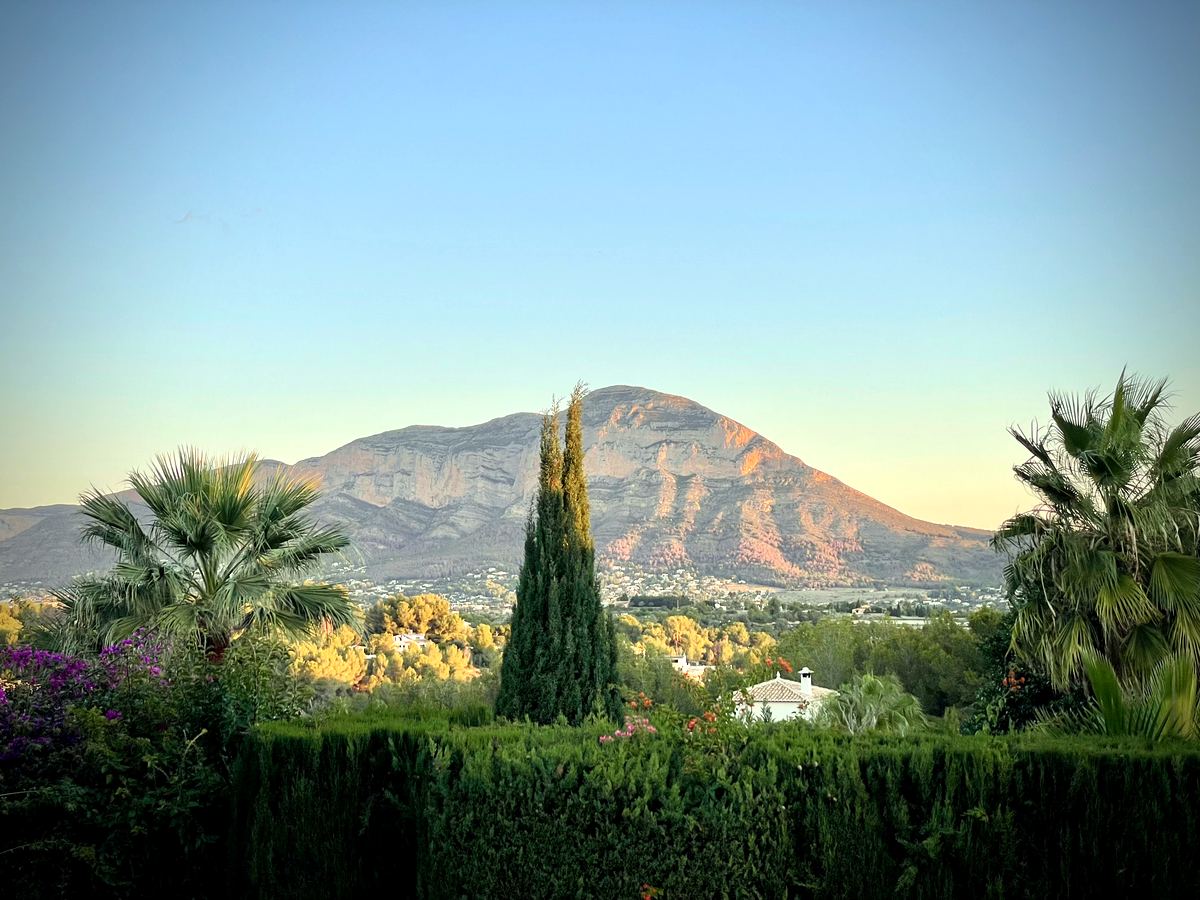 Golden evening light on Montgó above villa gardens in Jávea