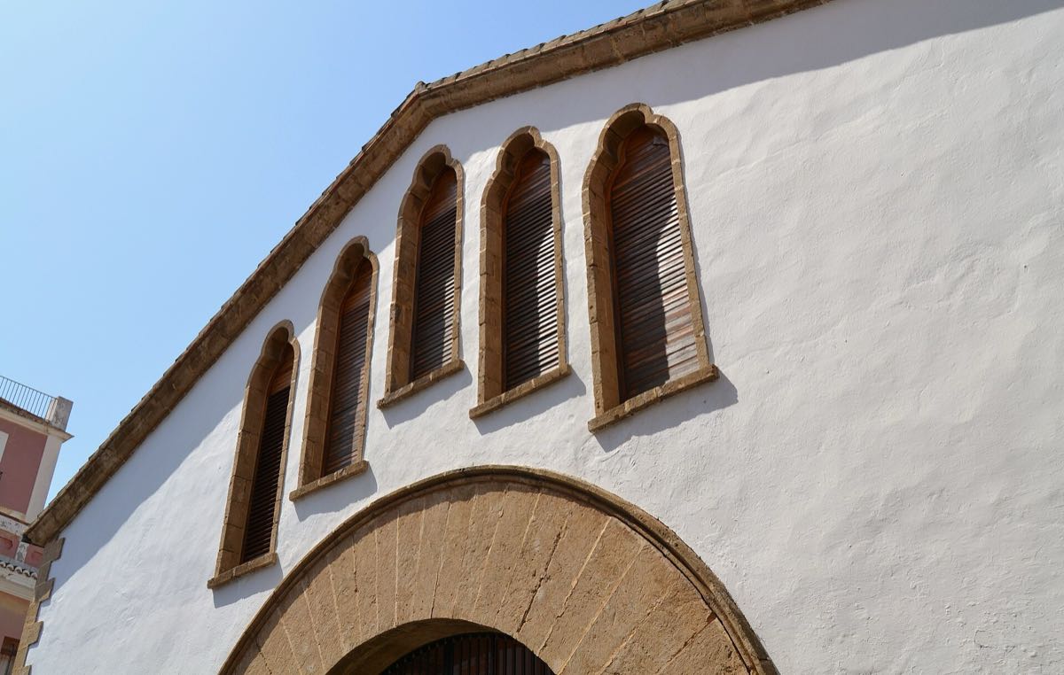 The Gothic-arched facade of the Mercat Municipal in Jávea old town